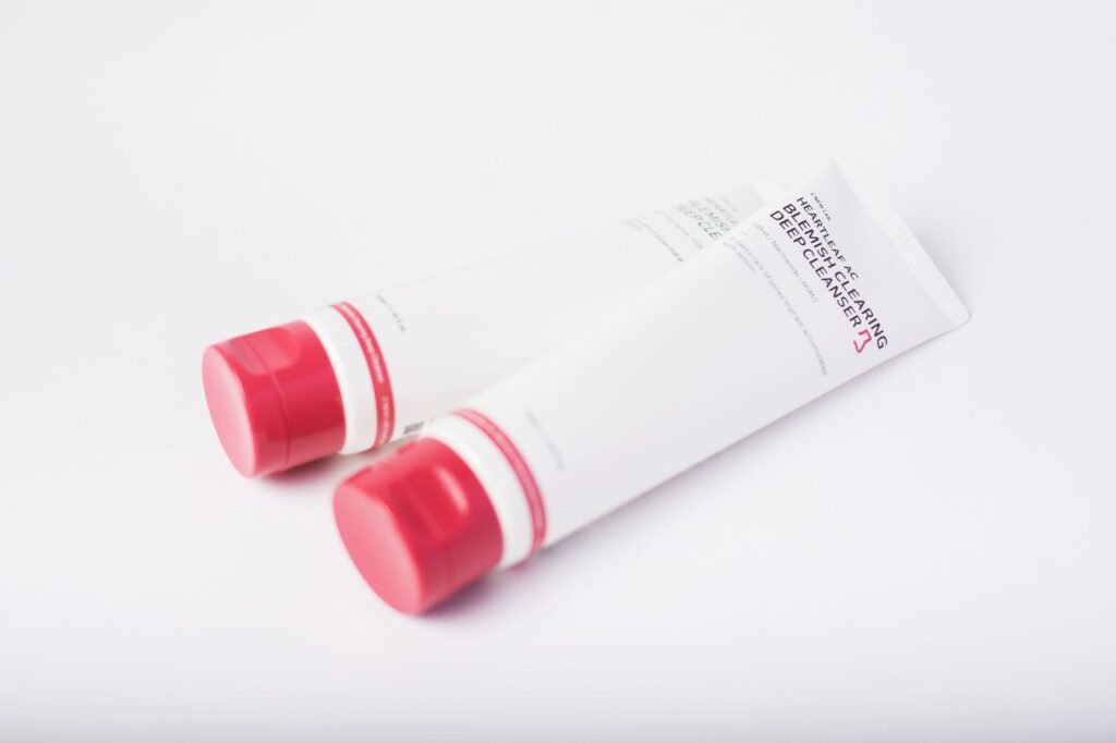 A plain white tube of azelaic acid cream on a neutral surface