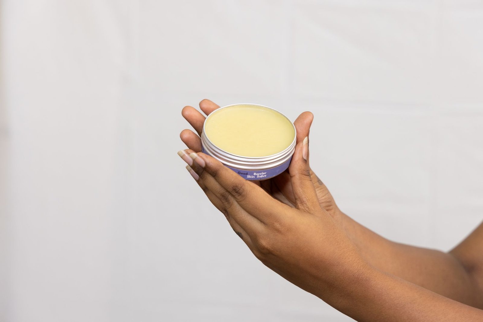 A thick moisturiser in an open jar, used as a buffer under retinol