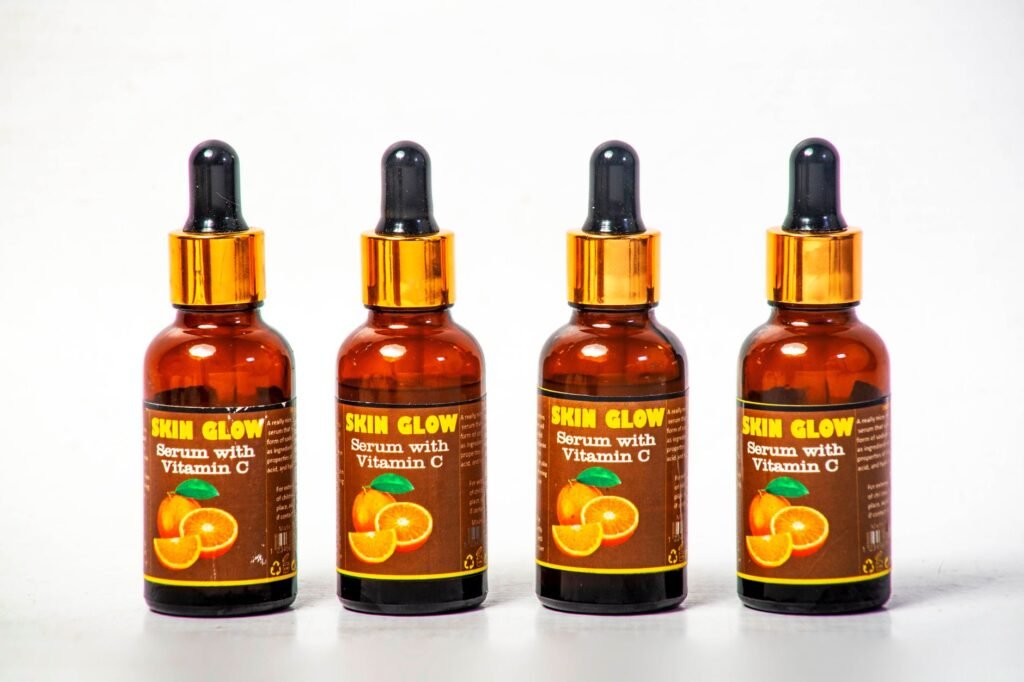 A vitamin C serum in a dark glass bottle with a dropper